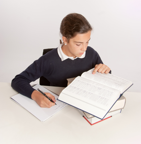 A girl reading a dictionary